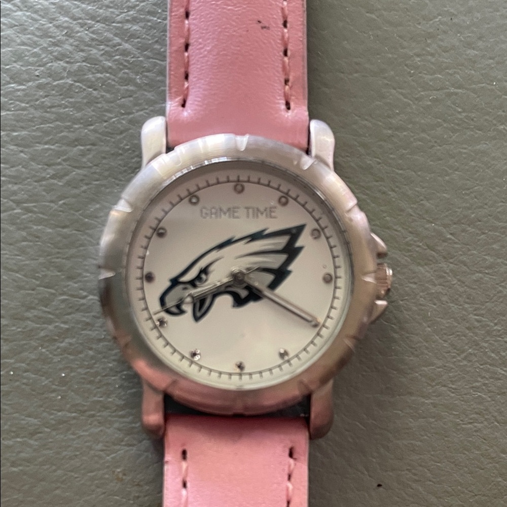 Pink Leather Strap Watch with Eagle Logo collector item. Needs a battery